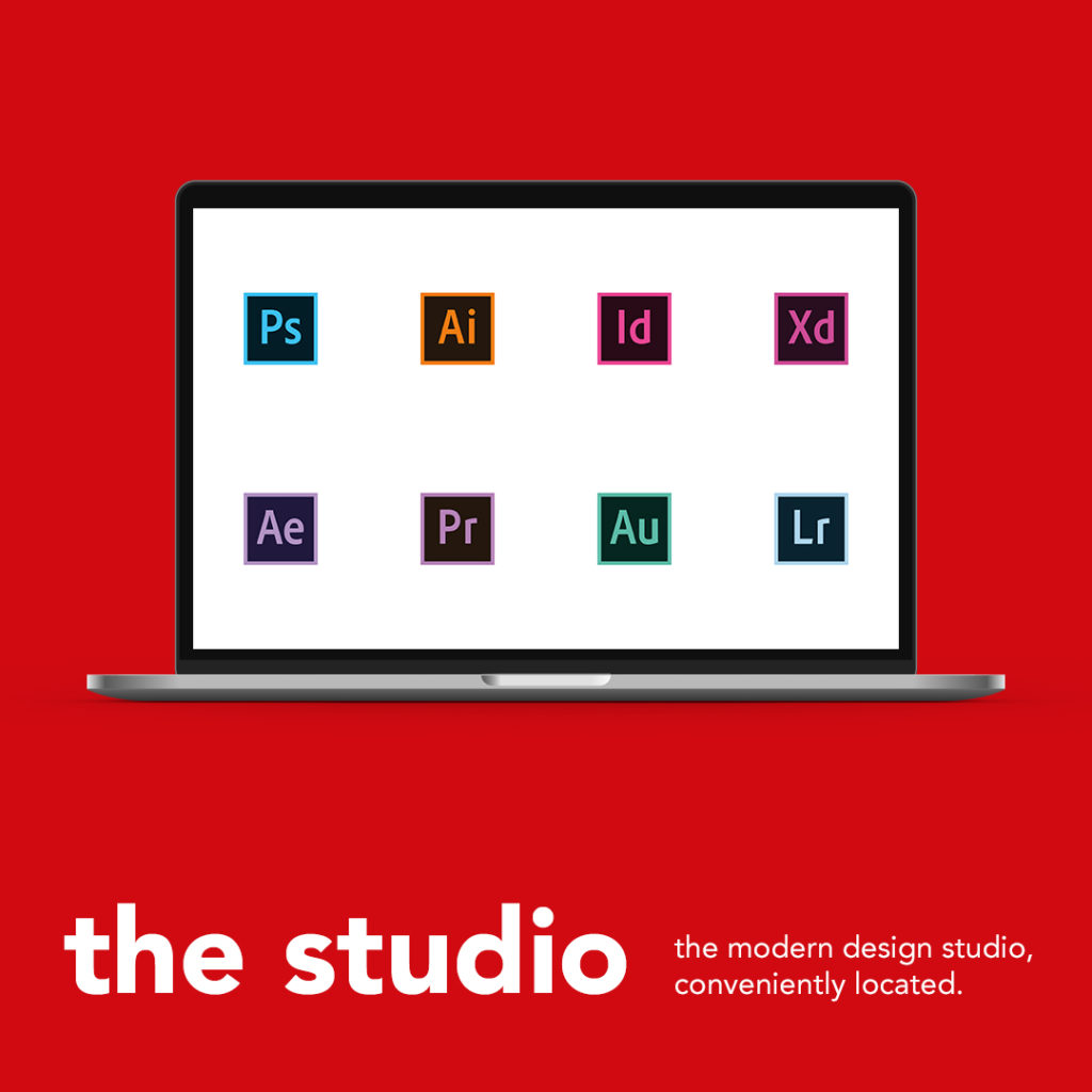 The studio. Laptop with Adobe creative suite on screen.
